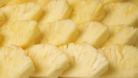 Fresh juicy sliced pineapple fruit background Stock Footage 344604624