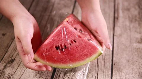 Fresh keeping of watermelon wrapped with plastic wrap (2) Stock Footage 202154546