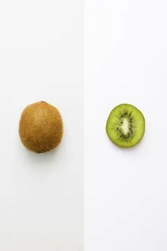 Fresh kiwi whole fruit and slice on grey white background Stock Photos