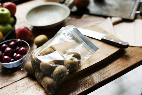 Fresh kiwi in a zip bag on the table Stock Photos