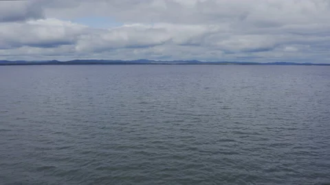 A fresh lake under a cloudy sky Stock Footage 149682936