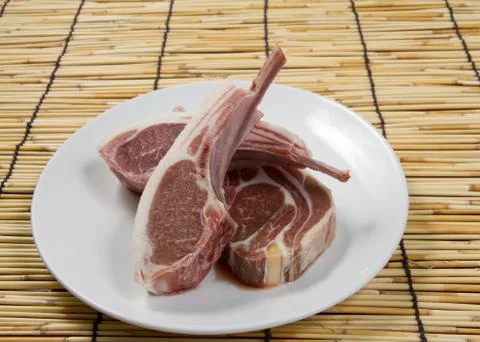 Fresh lamb on the plate. Stock Photos