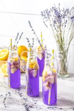 Fresh lavender violet cocktail with lemon and ice Stock Photos