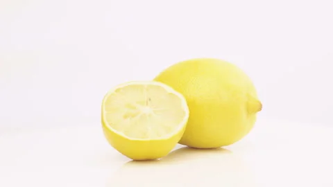 Fresh Lemon And Half Rotating Isolated On White Background (Seamless Looping) Video stock 108951148
