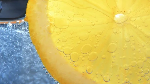 Fresh lemon dropped into water Stock Footage 61295221