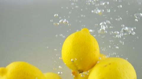Fresh lemon fall into water Video stock 247309322