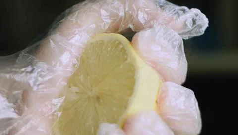 Fresh Lemon Half Being Squeezed for the Cookie Recipe Stock Photos