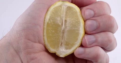 Fresh Lemon Juice Being Squeezed By Male Hand Stock Footage 73339218