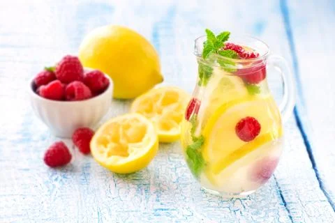 Fresh lemon, raspberry and mint fruit infused detox water or homemade lemonade Stock Photos