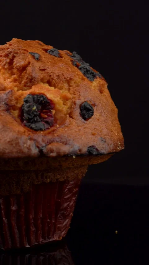 Fresh Lemon Raspberry Muffin Rotating on Dark Background Stock Footage 330517436