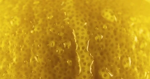 Fresh Lemon skin texture close up macro background water droplet flowing 4K Stock Footage 83465854