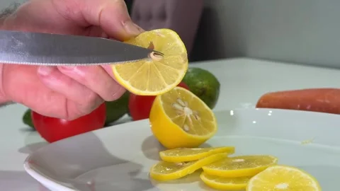 Fresh lemon sliced on Kitchen board Slicing yellow lemon 스톡 동영상 323295493