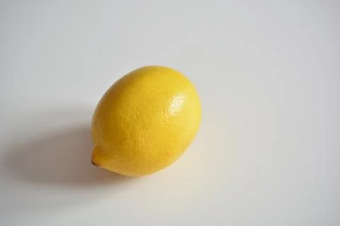 Fresh lemon on a white table Stock Photos