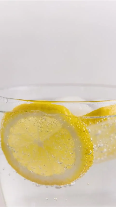 Fresh Lemonade with Soda Bubbles and Ice Cubes Stock Footage 331519581