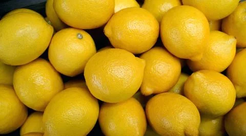 Fresh lemons as background, closeup. Foto stock