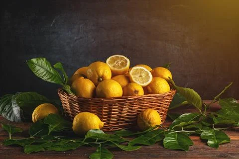 Fresh lemons in basket Stock Photos