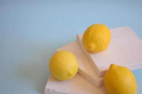 Fresh lemons on a blue background Stock Photos