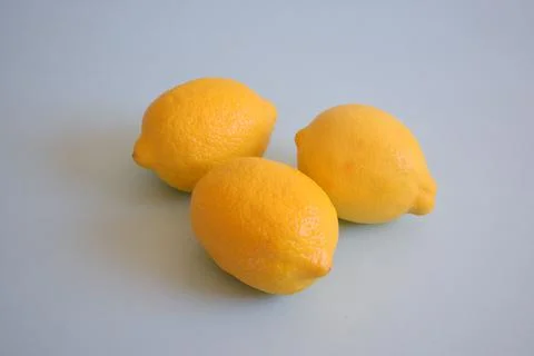 Fresh lemons on a blue background Stock Photos