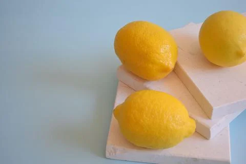 Fresh lemons on a blue background Stock Photos