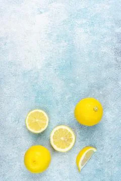 Fresh lemons on bright background. Lemon fruit citrus. Composition with who.. Stock Photos