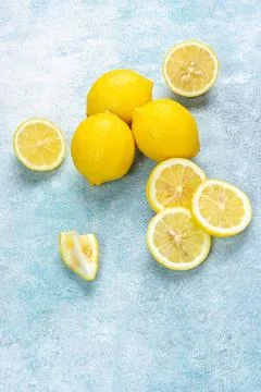 Fresh lemons on bright background. Lemon fruit citrus. Composition with who.. Stock Photos