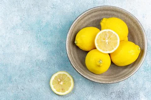 Fresh lemons on bright background. Lemon fruit citrus. Composition with who.. Stock Photos