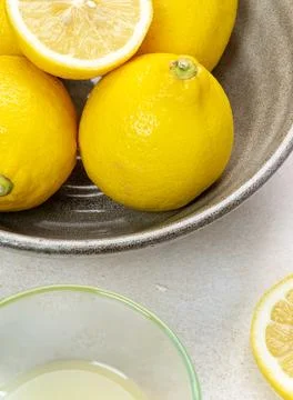 Fresh lemons on bright background. Lemon fruit citrus. Composition with who.. Stock Photos