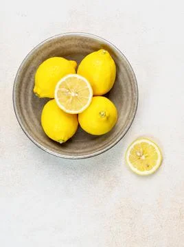 Fresh lemons on bright background. Lemon fruit citrus. Composition with who.. Stock Photos