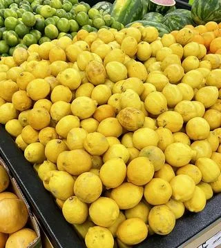 Fresh Lemons on display. Stock Photos