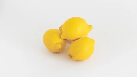 Fresh lemons on the white background Stock Photos