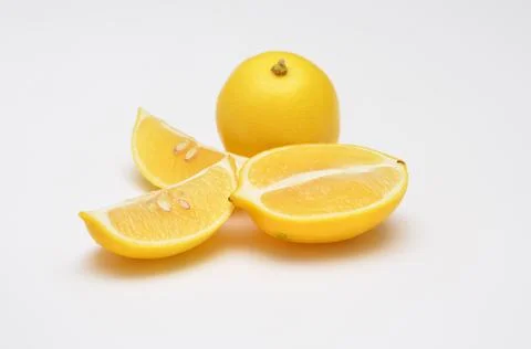 Fresh lemons on a white background, selective focus Stock Photos
