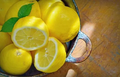 Fresh lemons on a wood table Stock Photos