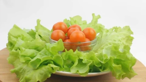 Fresh Lettuce and Cherry Tomatoes Rotating in a Bowl Stock Footage 83167345