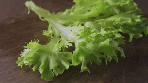 Fresh lettuce on a dark background close-up Vídeo Stock 131726182