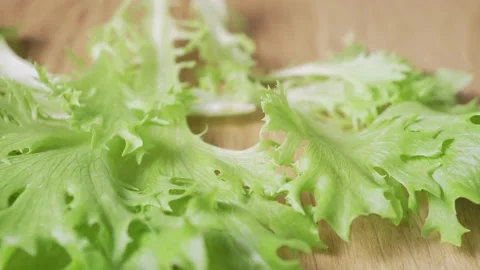 Fresh lettuce on a dark background close-up Video stock 131727185