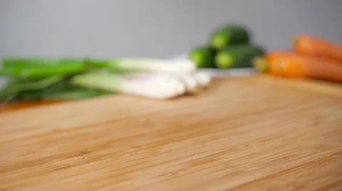 Fresh Lettuce Falling On a Woden Board Vídeo Stock 64044232