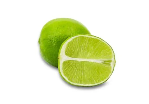 Fresh lime fruit cut in half on white surface Stock Photos
