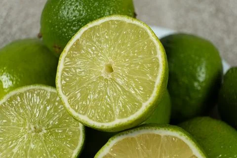 Fresh lime fruit halves close-up Stock Photos