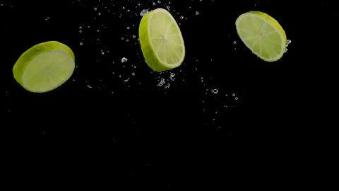 Fresh Limes Falling Into Water Video stock 132335082