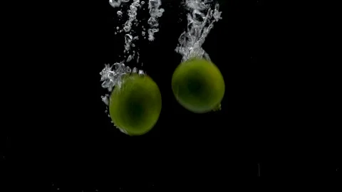 Fresh Limes Falling in Water Video stock 132335587