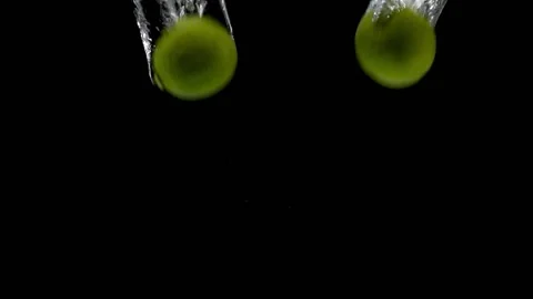 Fresh Limes Into Water Video stock 132335679