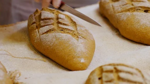 Fresh loaf of bread on the table Stock Footage 98252700