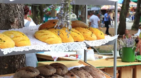 A fresh loaves of local breads at open-air food market 스톡 동영상 64919721