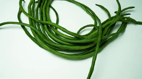 Fresh Long Green Beans on Light Background, A bunch of long, green, slender.. Stock Footage 305044770