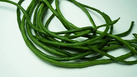 Fresh Long Green Beans on Light Background, A bunch of long, green, slender.. Stockbeeldmateriaal 305044821