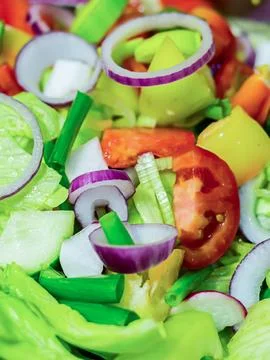 Fresh lunch salad ring red onion lettuce tomatoes in a metal full bowl clos.. Stock Photos