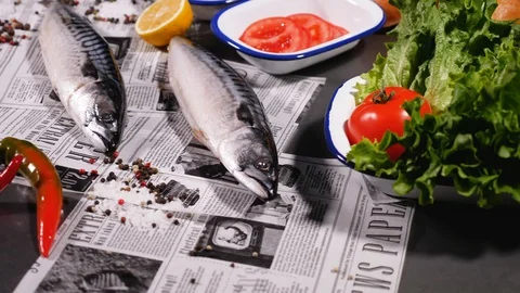 Fresh mackerel next to fresh bread, onions, pickles, tomato and herbs and pepper Stock Footage 127959990