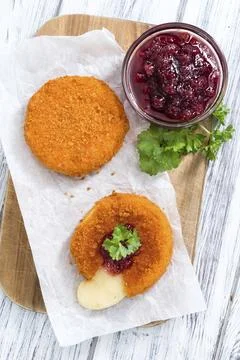 Fresh made Fried Camembert (selective focus) on wooden background Stock Photos