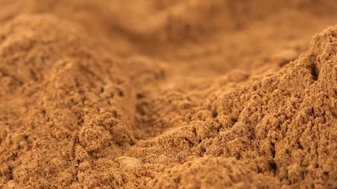 Fresh made Ground Cinnamon (seamless loopable; 4K) Stock Footage