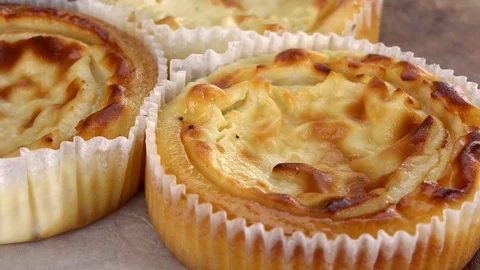 Fresh made mini Cheesecakes (seamless loopable; 4K) Stock Footage